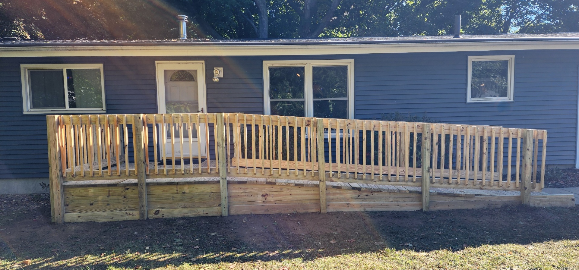 ADA-compliant composite ramp blending with a home's front entry