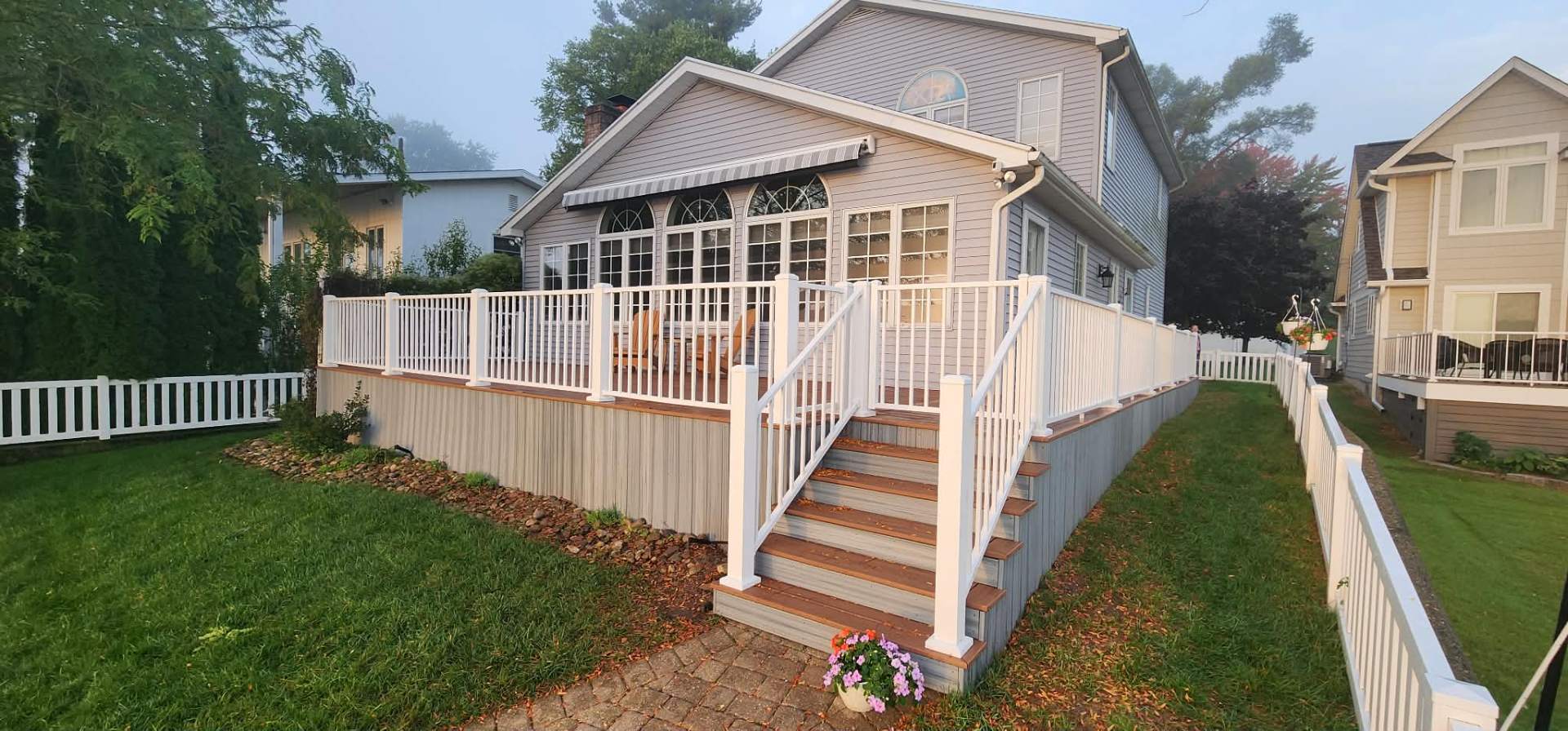Multi-level composite deck with stairs and built-in seating