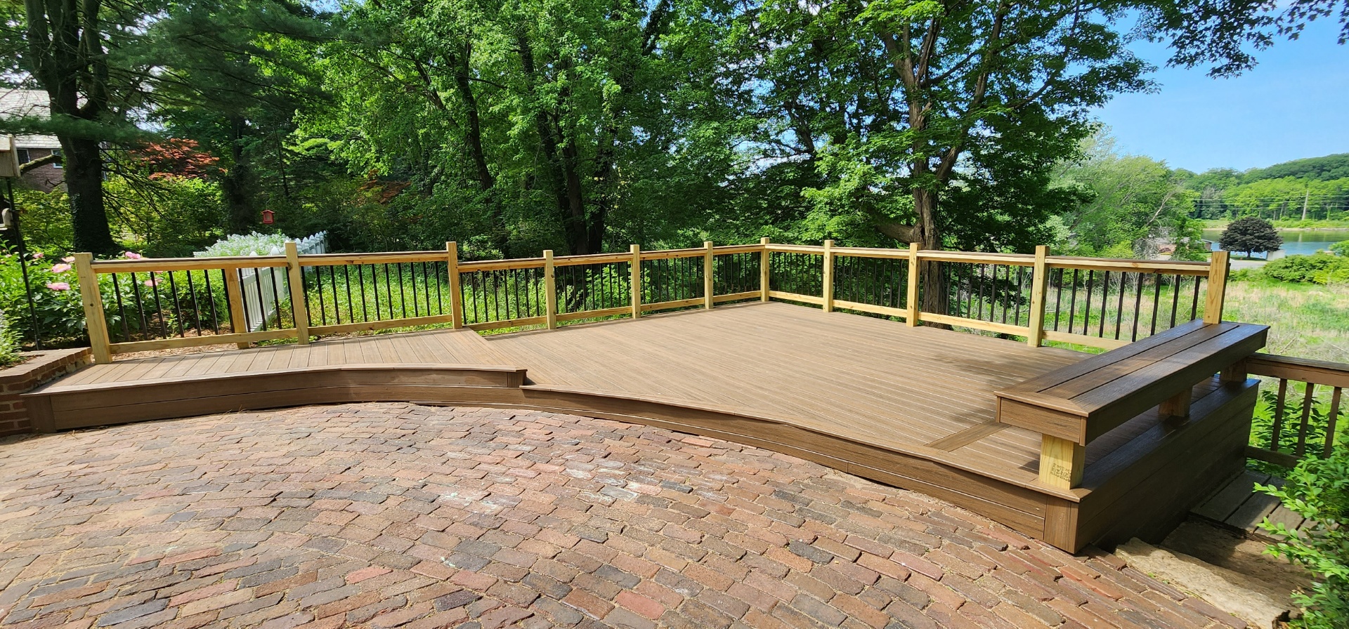 Composite Deck with Brick Patio – Decks project by Semper Gumby Construction