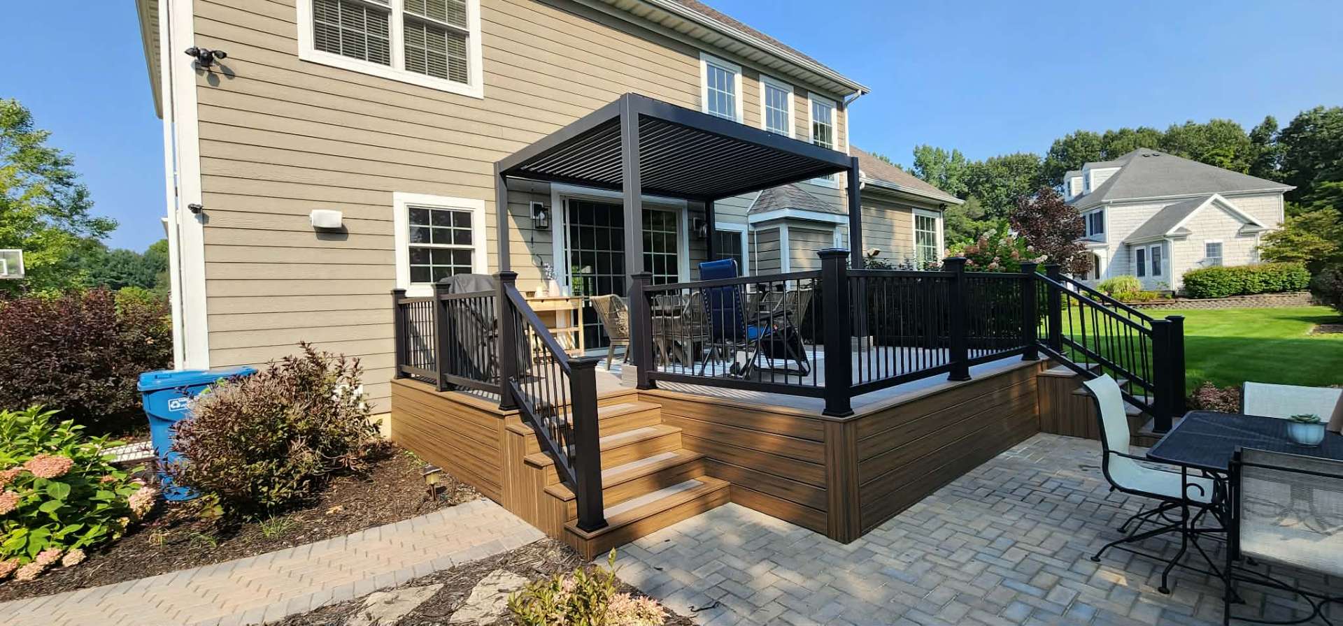 Large composite deck with railing and outdoor furniture